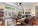 Open living room features wood floors, high ceilings, and access to outdoor space at 702 Compass Point Dr., North Myrtle Beach, SC 29582