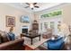 Comfortable living room with fireplace, ceiling fan, and plenty of seating at 702 Compass Point Dr., North Myrtle Beach, SC 29582