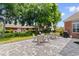 Landscaped backyard featuring a stone patio and outdoor seating, perfect for entertaining at 702 Compass Point Dr., North Myrtle Beach, SC 29582