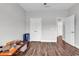 Bedroom featuring hardwood floors, neutral paint, and plentiful closet space at 7377 Pauley Swamp Rd., Conway, SC 29527