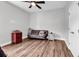 Spare bedroom with a futon, overhead fan, hardwood flooring, and neutral paint at 7377 Pauley Swamp Rd., Conway, SC 29527