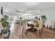 Open-concept dining area with a wooden table, chairs, and view of the living room at 7377 Pauley Swamp Rd., Conway, SC 29527