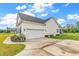 Exterior featuring attached garage, driveway, and landscaping at 7377 Pauley Swamp Rd., Conway, SC 29527