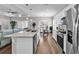 Well-lit kitchen boasting white cabinets, modern appliances, and an island with an eat-in bar at 7377 Pauley Swamp Rd., Conway, SC 29527