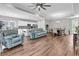 Spacious open-concept living space with hardwood floors, dining area, and a living room at 7377 Pauley Swamp Rd., Conway, SC 29527