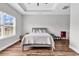 Bright main bedroom featuring hardwood floors and large windows with a view of the outdoors at 7377 Pauley Swamp Rd., Conway, SC 29527