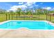 Outdoor pool featuring a concrete patio and black metal safety fence at 7377 Pauley Swamp Rd., Conway, SC 29527