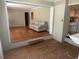 Spacious living room featuring a cozy couch and seamless transition to the kitchen at 7708 Woodland Dr., Myrtle Beach, SC 29572