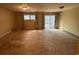 Inviting living room with sliding glass doors leading to the outdoor deck and backyard at 7708 Woodland Dr., Myrtle Beach, SC 29572