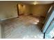 Large living room offering great potential for customization and bright natural light at 7708 Woodland Dr., Myrtle Beach, SC 29572