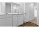 Bathroom featuring a double vanity and a walk-in shower at 786 Nw Palm Frond Way # 51, Calabash, NC 28467