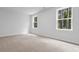 Bright bedroom features two windows and plush carpeting at 786 Nw Palm Frond Way # 51, Calabash, NC 28467