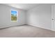 Bright bedroom featuring neutral carpet, a window providing natural light, and light-colored walls at 786 Nw Palm Frond Way # 51, Calabash, NC 28467