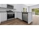 Kitchen with stainless steel appliances and granite countertops at 786 Nw Palm Frond Way # 51, Calabash, NC 28467