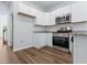 Features white cabinets, stainless appliances, and granite countertops at 786 Nw Palm Frond Way # 51, Calabash, NC 28467