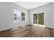 Spacious living room with sliding glass doors and natural light at 786 Nw Palm Frond Way # 51, Calabash, NC 28467
