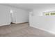 Bright loft area with neutral carpet, white walls, and an adjacent bathroom offers versatile living space at 786 Nw Palm Frond Way # 51, Calabash, NC 28467