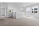 Loft area with plush carpeting, neutral walls, and natural light at 786 Nw Palm Frond Way # 51, Calabash, NC 28467