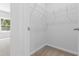 Walk-in closet featuring neutral carpet and wire shelving for easy organization and ample storage space at 786 Nw Palm Frond Way # 51, Calabash, NC 28467