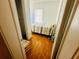 Comfortable bedroom with hardwood floors, a striped comforter, and a window at 8 Raymond St., Andrews, SC 29510