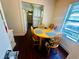 Bright dining area features an eat-in round table, natural light and direct access to kitchen at 8 Raymond St., Andrews, SC 29510