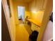 Hallway with built-in storage, and a workspace featuring a desk and cabinets at 8 Raymond St., Andrews, SC 29510