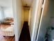 Hallway with view to living room and other room; includes hardwood floors and white walls at 8 Raymond St., Andrews, SC 29510
