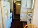 Bright kitchen features white appliances and cabinets, plus a cozy design at 8 Raymond St., Andrews, SC 29510