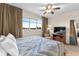 Relaxing bedroom features a large window, TV, and comfortable patterned bedding at 8121 Amalfi Pl. # 4706, Myrtle Beach, SC 29572