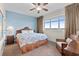 Comfortable bedroom featuring a ceiling fan, window view, and charming coastal decor at 8121 Amalfi Pl. # 4706, Myrtle Beach, SC 29572