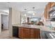Open kitchen with stainless appliances that flows into the living area at 8121 Amalfi Pl. # 4706, Myrtle Beach, SC 29572