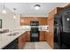 Modern kitchen featuring stainless steel appliances, ample counter space, and wood cabinets at 8121 Amalfi Pl. # 4706, Myrtle Beach, SC 29572