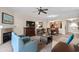 Comfortable living room with fireplace, furnishings, and an open view to dining area at 8121 Amalfi Pl. # 4706, Myrtle Beach, SC 29572