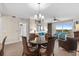 Open living and dining area featuring an elegant chandelier and comfortable seating at 8121 Amalfi Pl. # 4706, Myrtle Beach, SC 29572