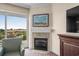 Comfortable living room featuring a fireplace and a sliding glass door to balcony with lovely views at 8121 Amalfi Pl. # 4706, Myrtle Beach, SC 29572