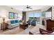 Relaxing living room with plush seating, a fireplace, balcony view, and contemporary decor at 8121 Amalfi Pl. # 4706, Myrtle Beach, SC 29572