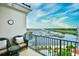 This balcony features comfortable seating and great views of the marina, golf course, and river at 8121 Amalfi Pl. # 7-805, Myrtle Beach, SC 29572