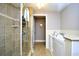 Bright and accessible bathroom featuring walk-in shower and safety equipped tub at 8121 Amalfi Pl. # 7-805, Myrtle Beach, SC 29572