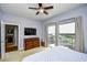 Well lit bedroom with balcony access, media center and comfortable furnishings at 8121 Amalfi Pl. # 7-805, Myrtle Beach, SC 29572