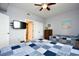 This is a bedroom with two beds, a mounted television, and a view into an adjacent bathroom at 8121 Amalfi Pl. # 7-805, Myrtle Beach, SC 29572
