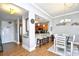 Open-concept dining area with breakfast bar and tile floors, adjacent to the kitchen and front entrance at 8121 Amalfi Pl. # 7-805, Myrtle Beach, SC 29572