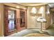The dining area is located behind glass paneled double doors with rustic handles, under warm lighting at 8121 Amalfi Pl. # 7-805, Myrtle Beach, SC 29572