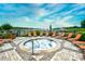 Relax and rejuvenate in this outdoor hot tub with views of the lake, surrounded by lounge chairs at 8121 Amalfi Pl. # 7-805, Myrtle Beach, SC 29572