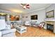 Bright living room with an open floor plan, fireplace, ceiling fan, and dining area perfect for entertaining at 8121 Amalfi Pl. # 7-805, Myrtle Beach, SC 29572