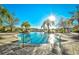 The sparkling outdoor pool features clear, cool water with several lounge chairs, trees and open views at 8121 Amalfi Pl. # 7-805, Myrtle Beach, SC 29572