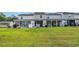 Townhome boasts a spacious, well-manicured backyard ideal for outdoor entertaining and leisure at 837 Triple Ct. # 837, Myrtle Beach, SC 29588