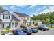 Beautifully designed townhomes with vibrant exteriors, lush landscaping, and convenient parking at 837 Triple Ct. # 837, Myrtle Beach, SC 29588
