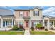 Charming townhome with manicured landscaping and inviting red front door at 837 Triple Ct. # 837, Myrtle Beach, SC 29588