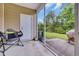 Enjoy outdoor relaxation on this screened patio with comfortable seating and backyard access at 837 Triple Ct. # 837, Myrtle Beach, SC 29588