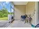 Enjoy outdoor relaxation on this screened patio with comfortable seating and backyard access at 837 Triple Ct. # 837, Myrtle Beach, SC 29588